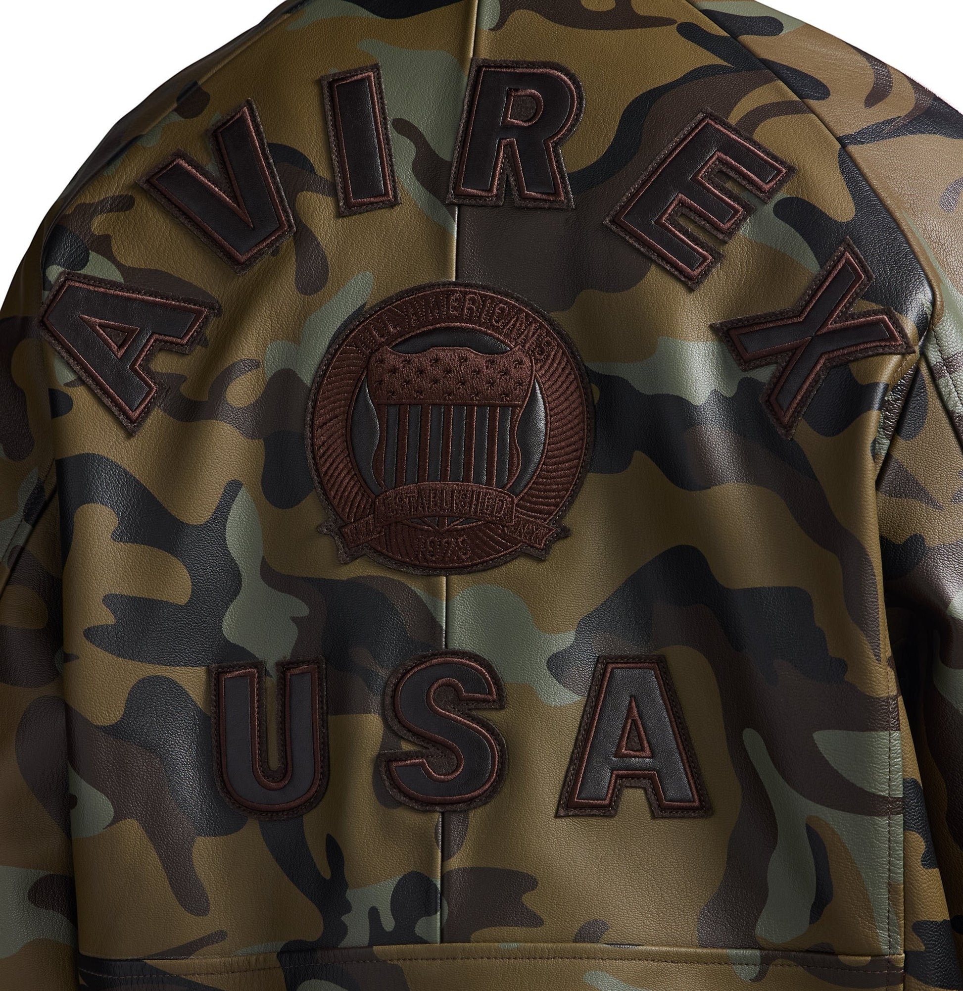 OFFCODE.USA leather bomber jacket with tonal camo print, "AVIREX USA" lettering, and embroidered crest patch.