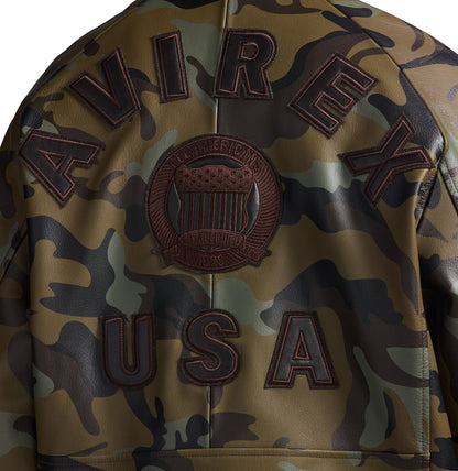 OFFCODE.USA leather bomber jacket with tonal camo print, "AVIREX USA" lettering, and embroidered crest patch.