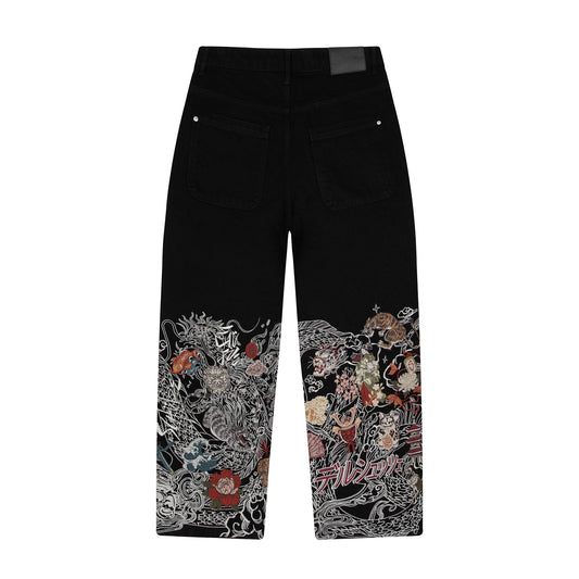 OFFCODE.USA black denim jeans with intricate dragon and floral embroidery on the lower legs, balloon fit, 100% cotton.