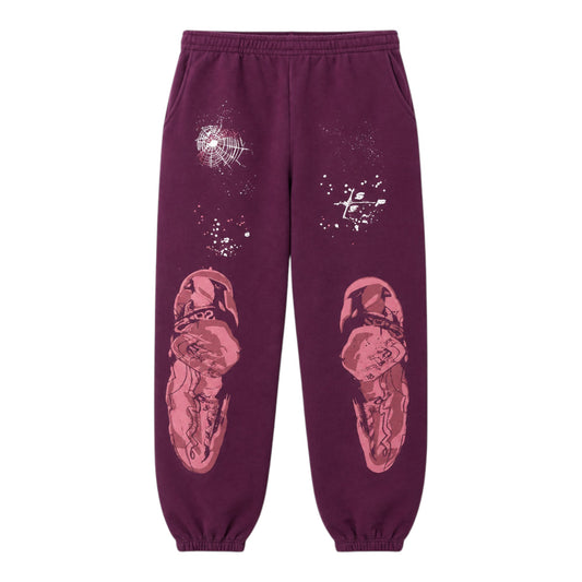 OFFCODE.USA plum purple sweatpants with graphic prints of figures and spiderwebs.