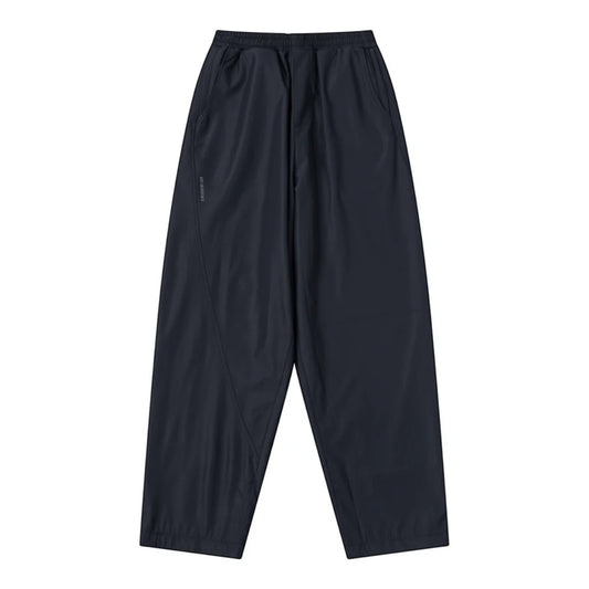 OFFCODE.USA dark navy tech joggers with asymmetrical paneling, reflective logos, and wide leg fit.