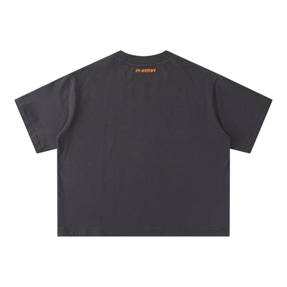 OFFCODE.USA Cracked Tee in charcoal grey, 100% cotton with boxy fit. Features embroidered graphic on back.