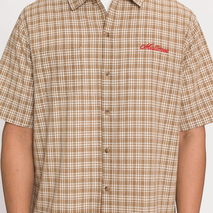 OFFCODE.USA brown and white plaid short-sleeve button-up shirt with red embroidered logo on chest.