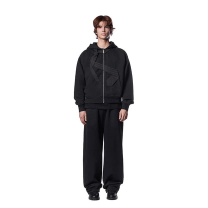 OFFCODE.USA black cotton zip-up hoodie with embroidered tie patch detail on front and back. Model wearing size L.
