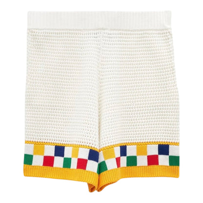 OFFCODE.USA white faux crochet shorts with yellow trim and colorful checkered pattern at hem.