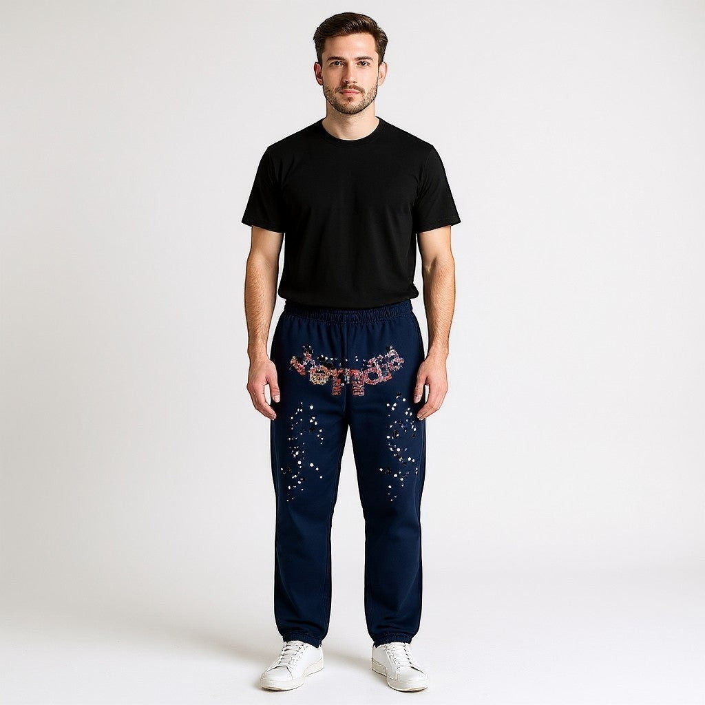 OFFCODE.USA Navy Kapok Jogger Pants with floral pattern and star-like embellishments. Leisure style.