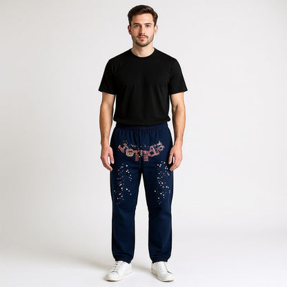 OFFCODE.USA Navy Kapok Jogger Pants with floral pattern and star-like embellishments. Leisure style.