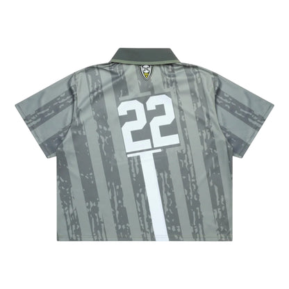 OFFCODE.USA Army football kit with a cropped, boxy fit, turndown collar, and sublimated graphics. 100% polyester.