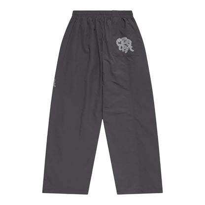 OFFCODE.USA grey nylon track pants with applique mesh logo on back pocket and white 3D piping.