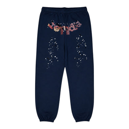 OFFCODE.USA navy blue kapok jogger pants with scattered white and black dot pattern and rhinestone logo.