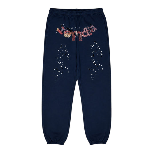 OFFCODE.USA navy blue kapok jogger pants with scattered white and black dot pattern and rhinestone logo.