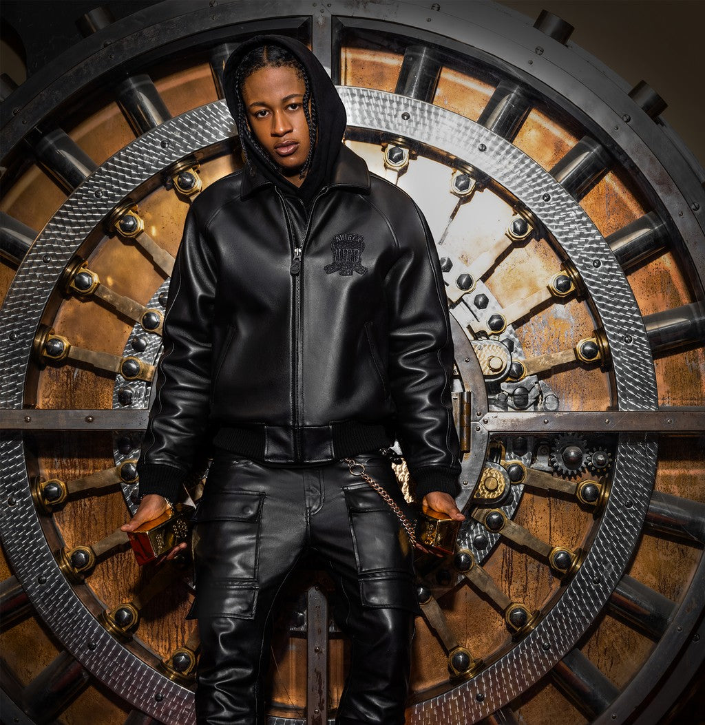 OFFCODE.USA Avirex Icon black leather bomber jacket with logo details, zip front, and ribbed cuffs. Model wears size M.
