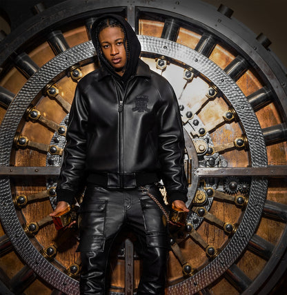 OFFCODE.USA Avirex Icon black leather bomber jacket with logo details, zip front, and ribbed cuffs. Model wears size M.