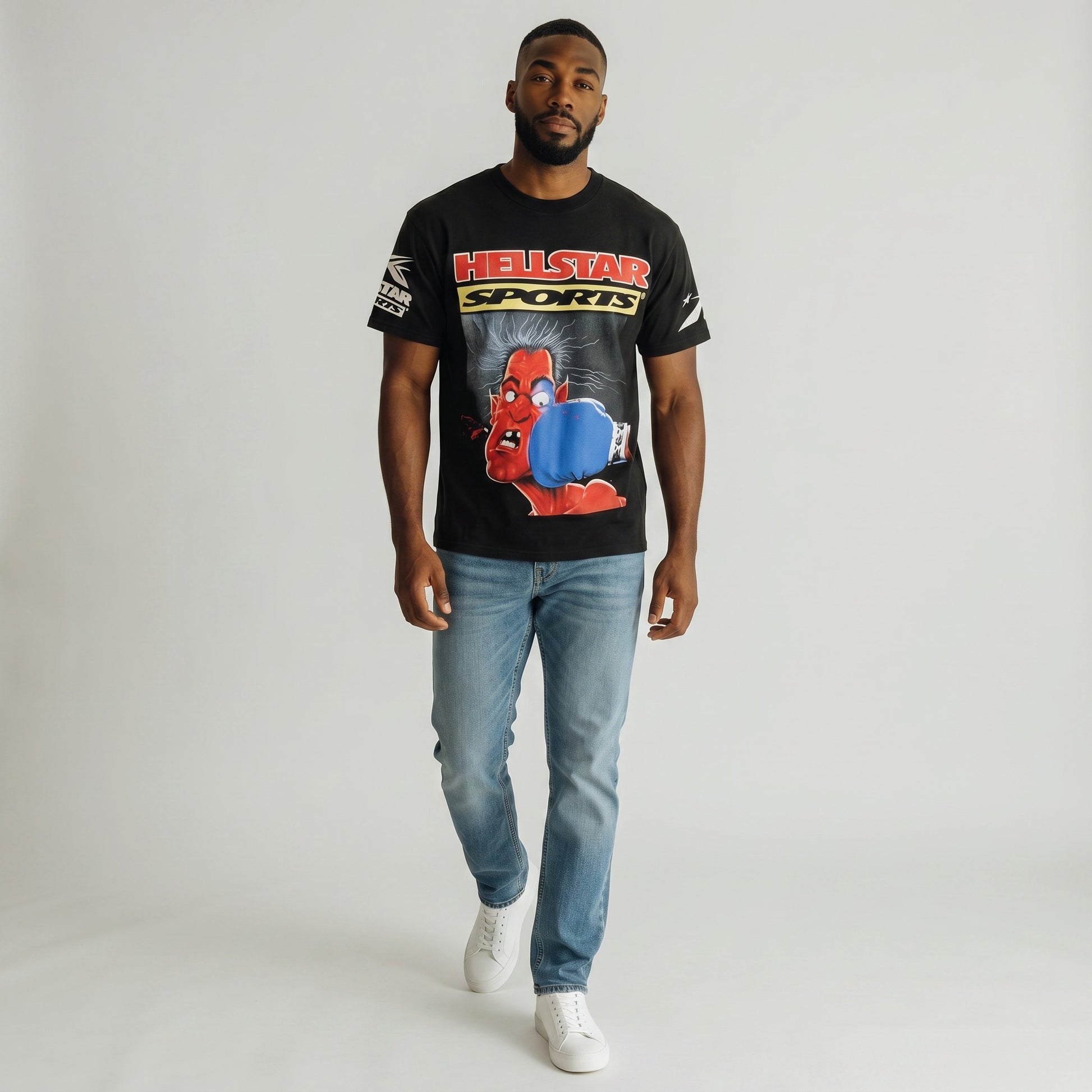 OFFCODE.USA black short-sleeved cotton t-shirt with a graphic print of a red devil being punched in the face by a blue boxing glove, with "HELLSTAR SPORTS" text.