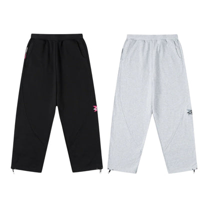 OFFCODE.USA MERTRA x Umbro black and grey warm-up joggers with zip cuffs and embroidered logos.